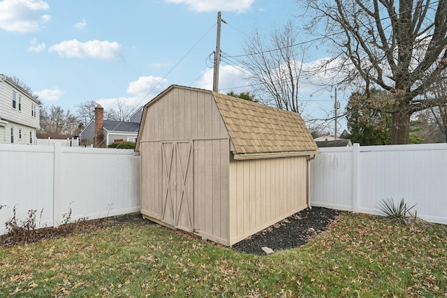 view of outdoor structure featuring a lawn