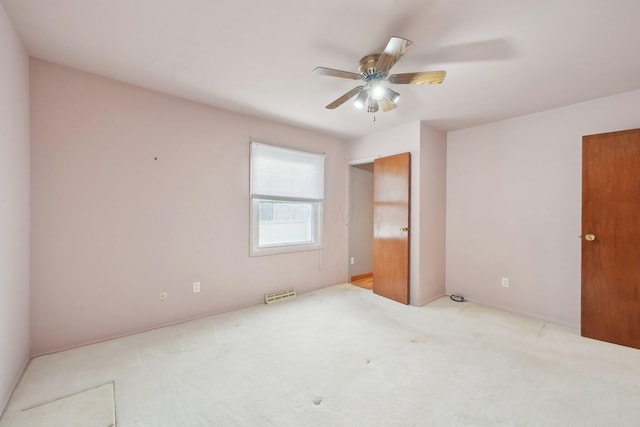 unfurnished bedroom featuring ceiling fan and light colored carpet