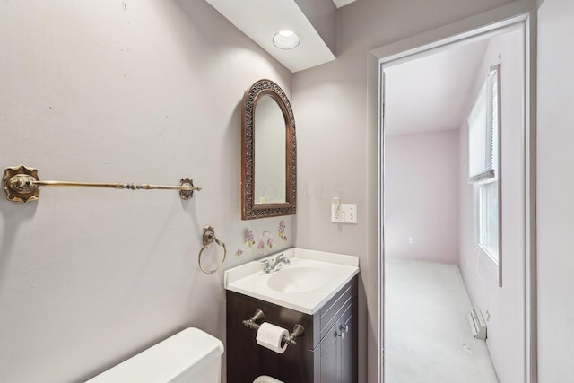 bathroom featuring vanity and toilet