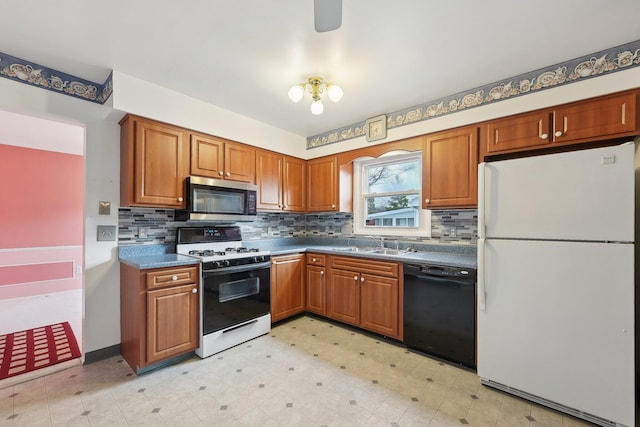 kitchen with decorative backsplash, sink, and white appliances