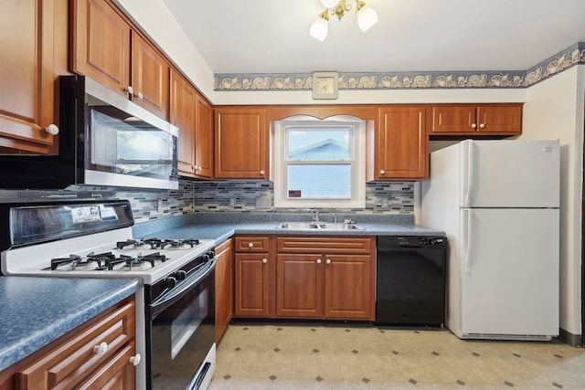 kitchen with white appliances, backsplash, and sink