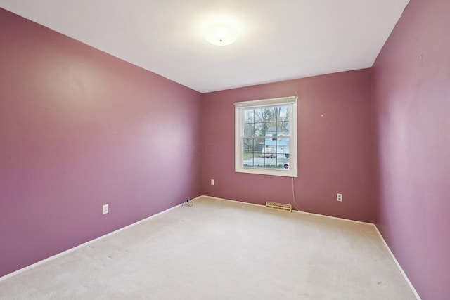 unfurnished room featuring carpet flooring