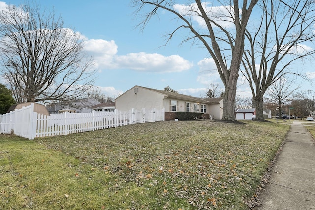 view of side of home featuring a lawn