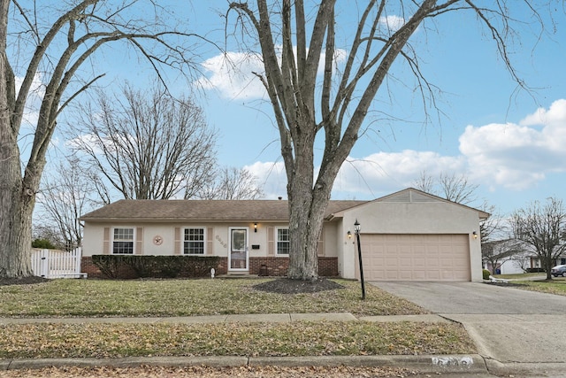 ranch-style home with a garage and a front lawn