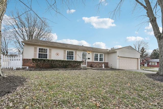 ranch-style house featuring a front lawn and a garage