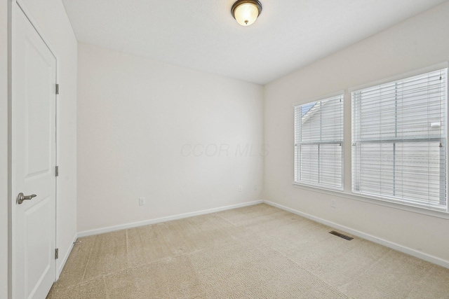 unfurnished room with carpet floors