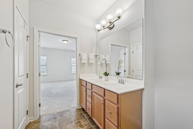 bathroom featuring a textured ceiling and vanity