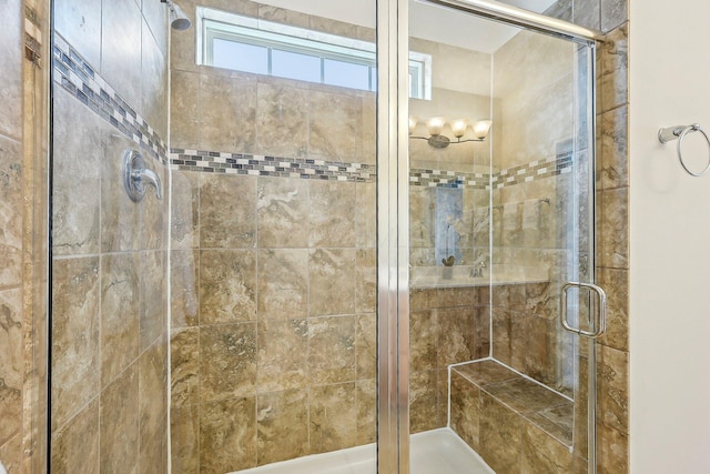 bathroom with a shower with shower door