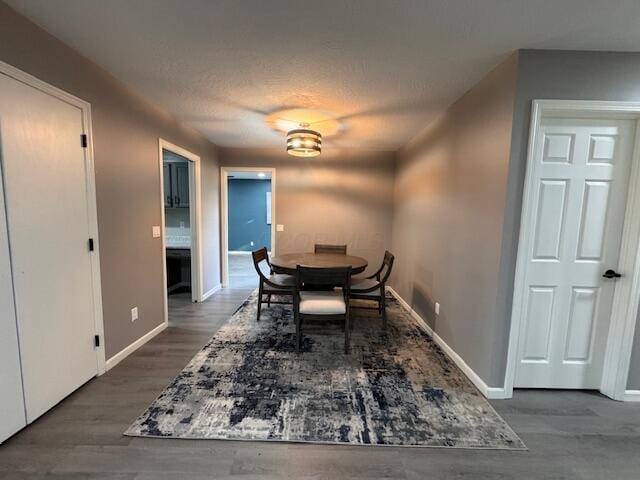 dining space with dark hardwood / wood-style floors