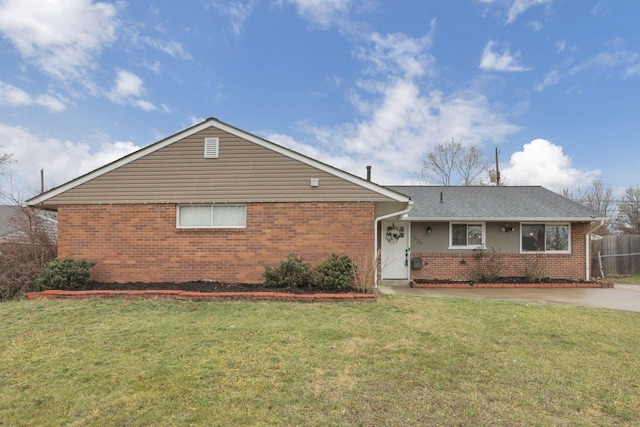 ranch-style home with a front lawn