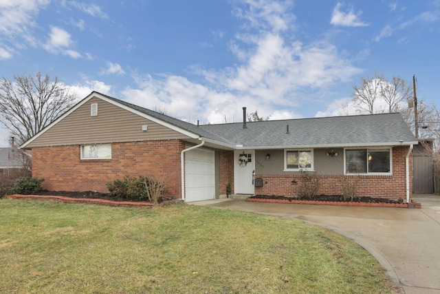 ranch-style house featuring a front yard and a garage