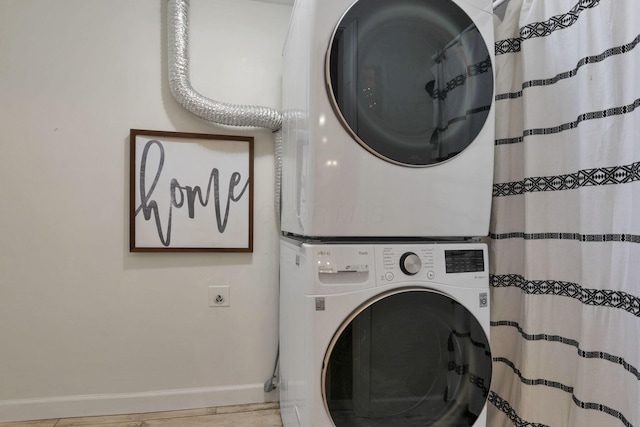 laundry area featuring stacked washer and clothes dryer