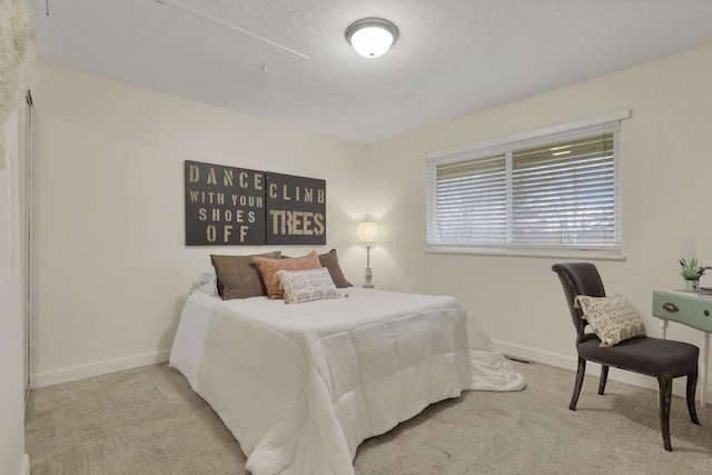 carpeted bedroom featuring a textured ceiling