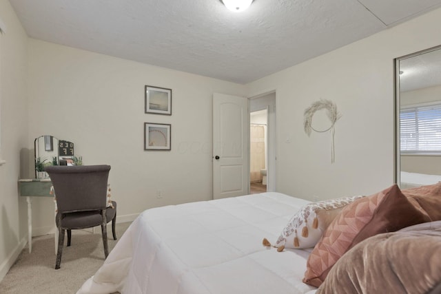 carpeted bedroom with a textured ceiling