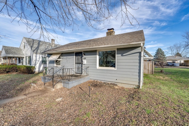 view of front of home with a front lawn