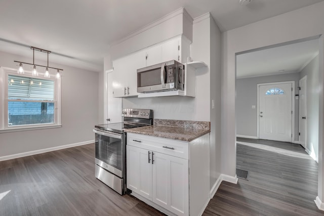 kitchen featuring white cabinets, dark hardwood / wood-style flooring, and appliances with stainless steel finishes