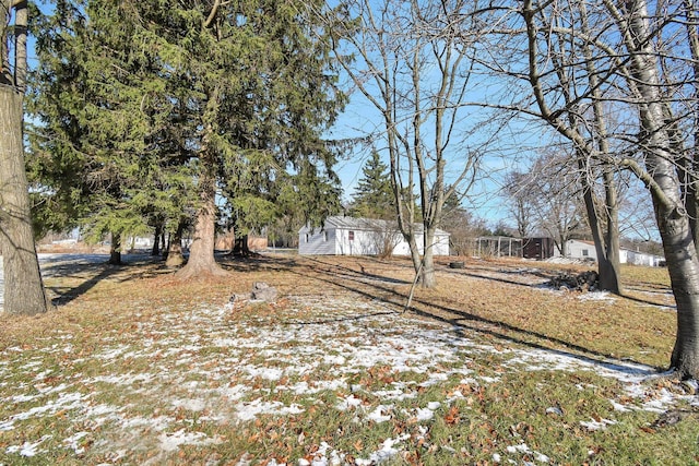 view of yard covered in snow