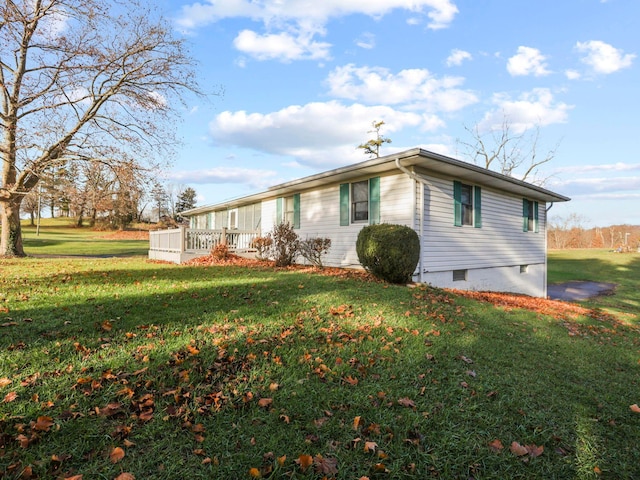 view of property exterior featuring a lawn