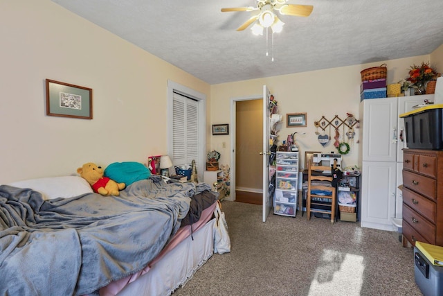 bedroom featuring a textured ceiling, a closet, and ceiling fan