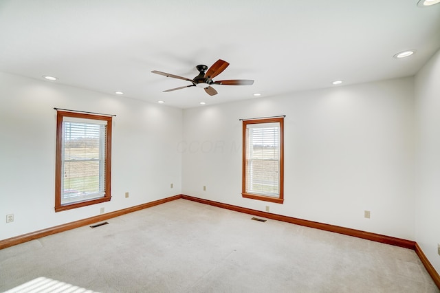 spare room with carpet flooring and ceiling fan