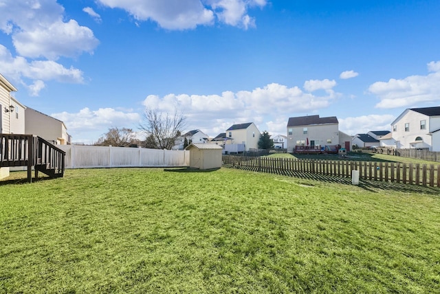 view of yard featuring a storage shed