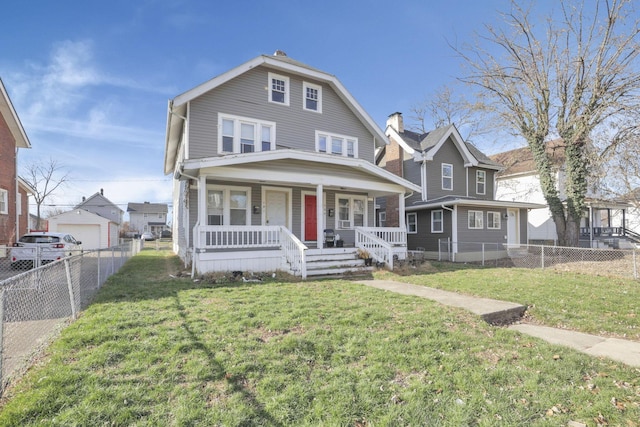 view of front of house with covered porch and a front lawn