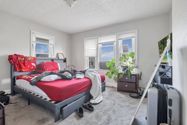 carpeted bedroom featuring a textured ceiling