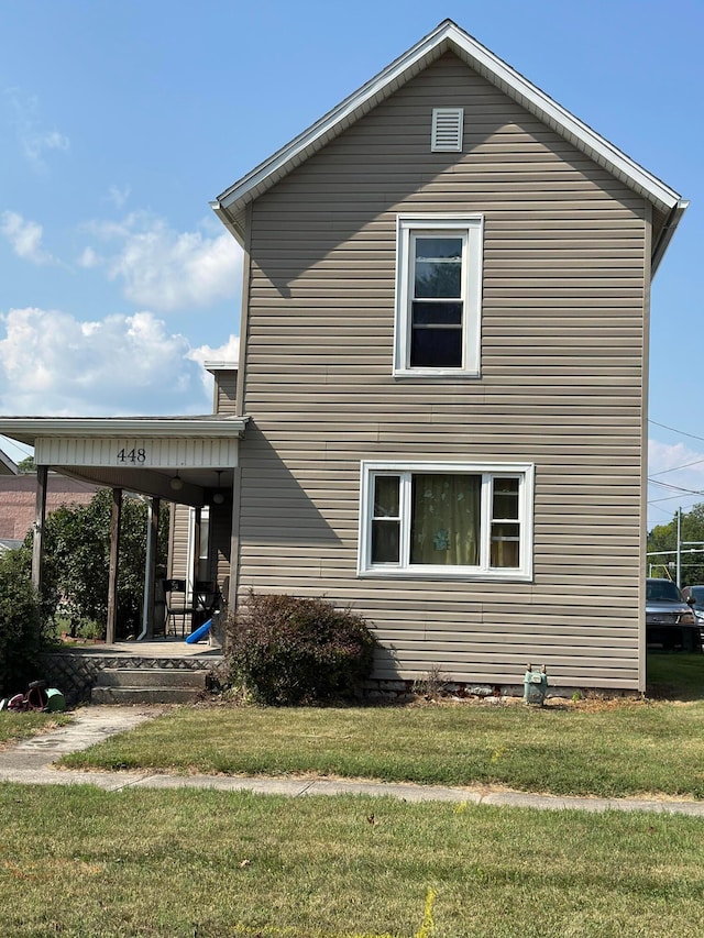 view of property exterior with a lawn