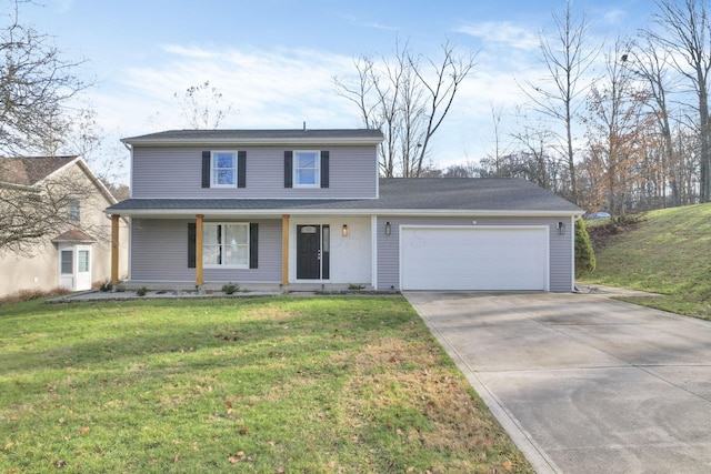 view of property featuring a garage and a front lawn