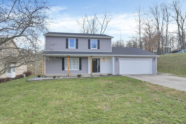 view of property featuring a front yard and a garage