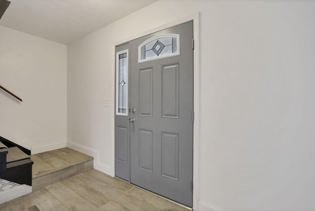 entryway with light hardwood / wood-style floors