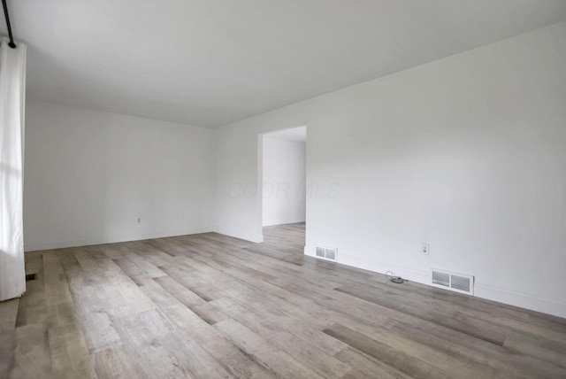 empty room featuring light hardwood / wood-style floors