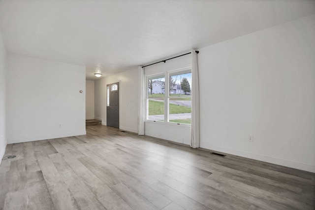 spare room with light wood-type flooring