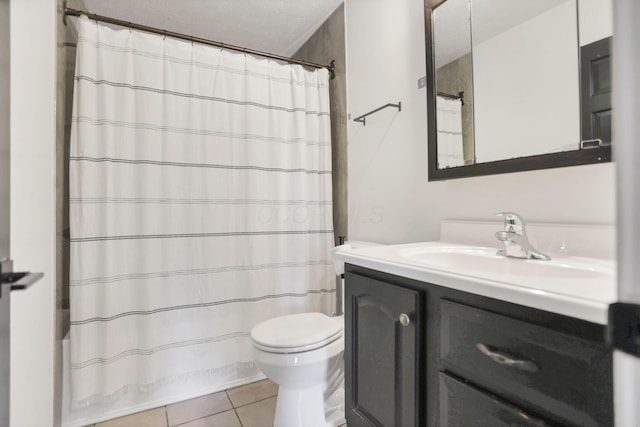 full bathroom featuring vanity, a textured ceiling, shower / tub combo with curtain, tile patterned flooring, and toilet