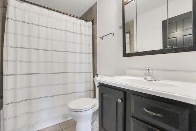 bathroom with walk in shower, tile patterned floors, a textured ceiling, toilet, and vanity