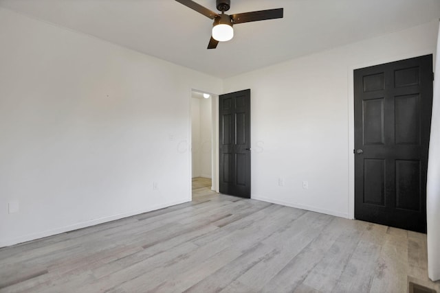 unfurnished room with ceiling fan and light hardwood / wood-style flooring