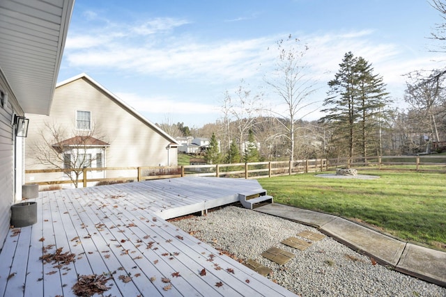 wooden terrace with a lawn