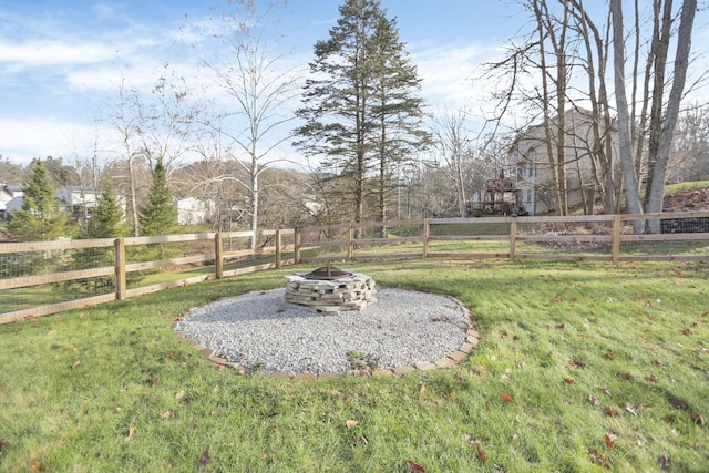 view of yard with an outdoor fire pit