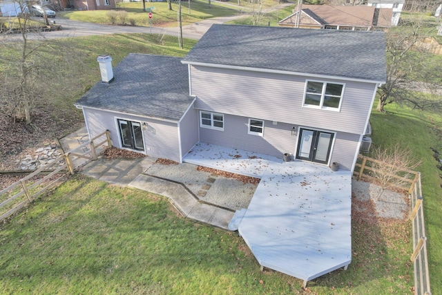 back of house featuring a yard and a patio