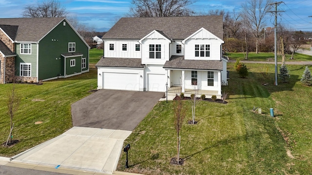 view of front of home featuring a porch, a garage, and a front yard