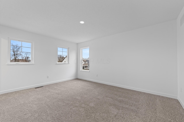 view of carpeted spare room