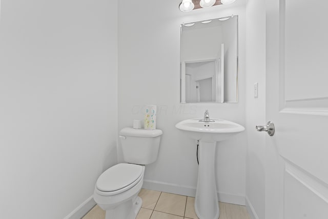 bathroom with tile patterned floors and toilet