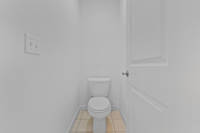 bathroom with tile patterned floors and toilet