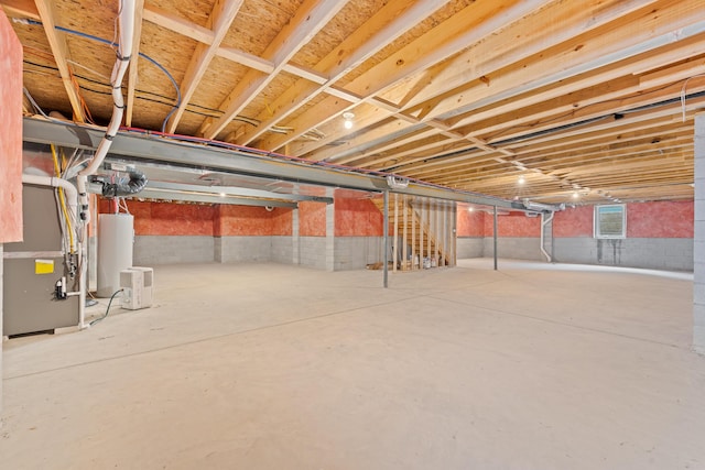 basement with heating unit and water heater