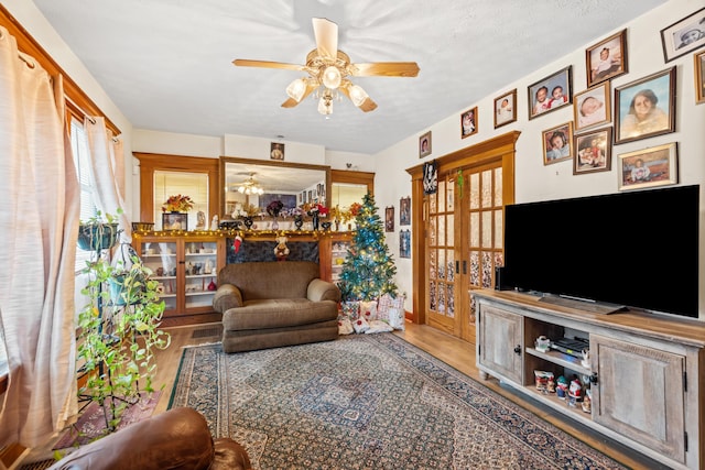 living room with wood-type flooring and a textured ceiling