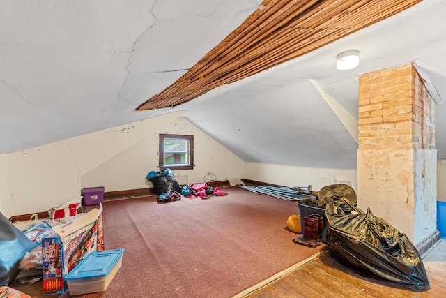 playroom with hardwood / wood-style floors and vaulted ceiling