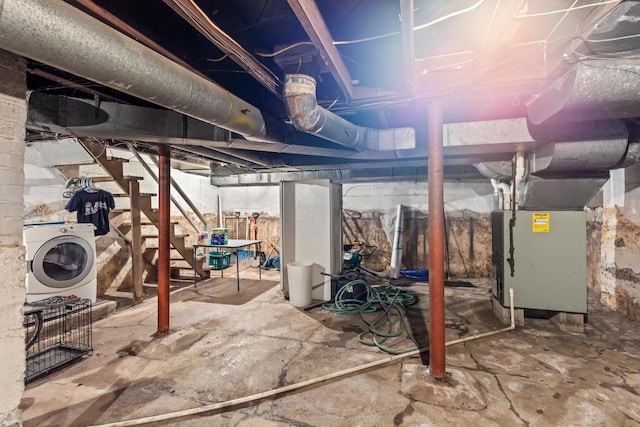 basement with washer / dryer and heating unit