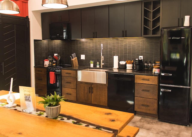 kitchen with black appliances, decorative backsplash, dark brown cabinetry, and sink