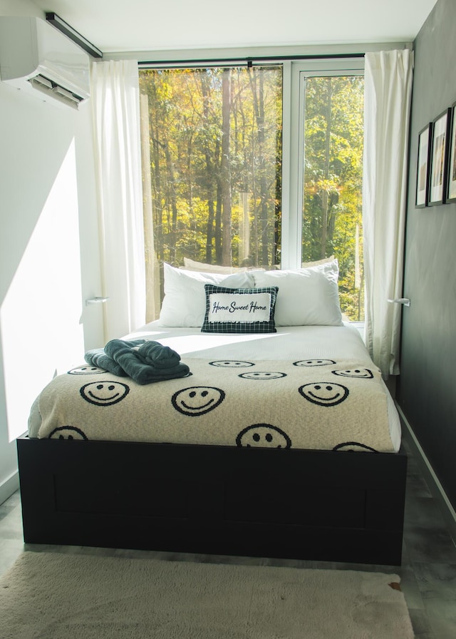 bedroom with a wall unit AC