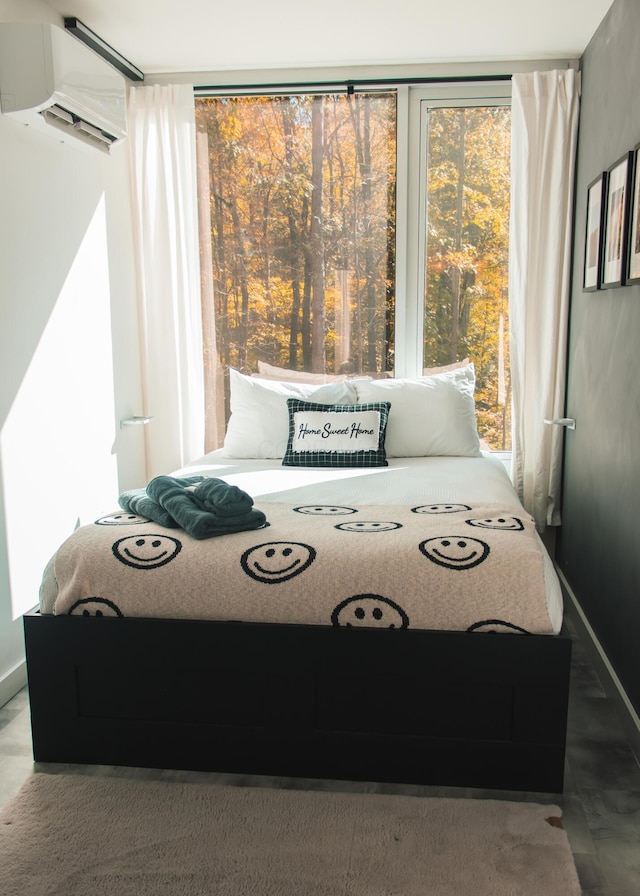 bedroom featuring a wall mounted AC